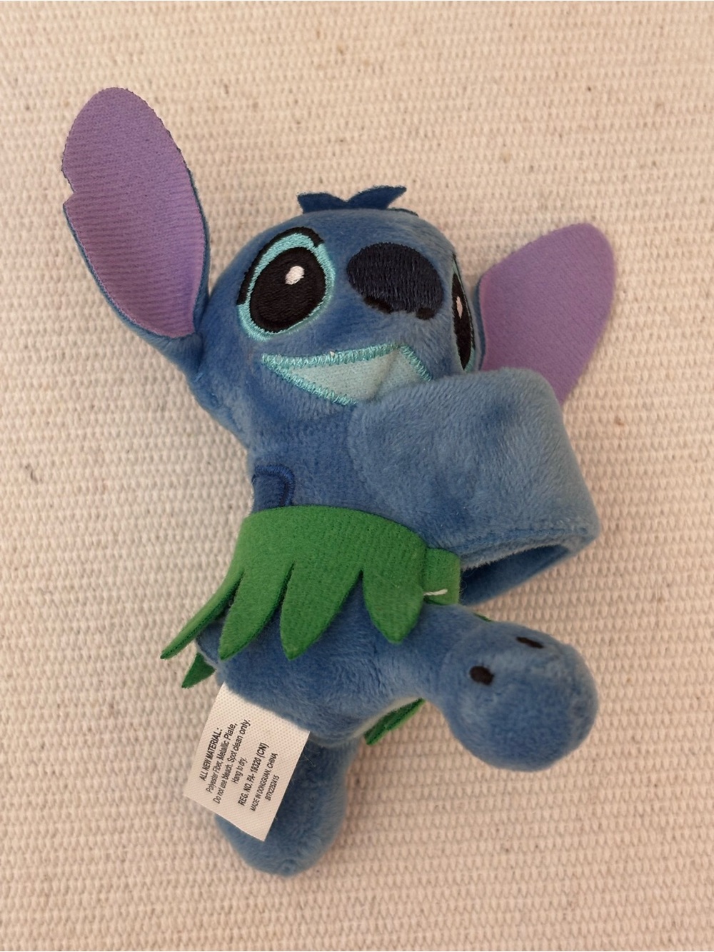 Disney Stitch with grass skirt Cutie Cuff plush slap bracelet.